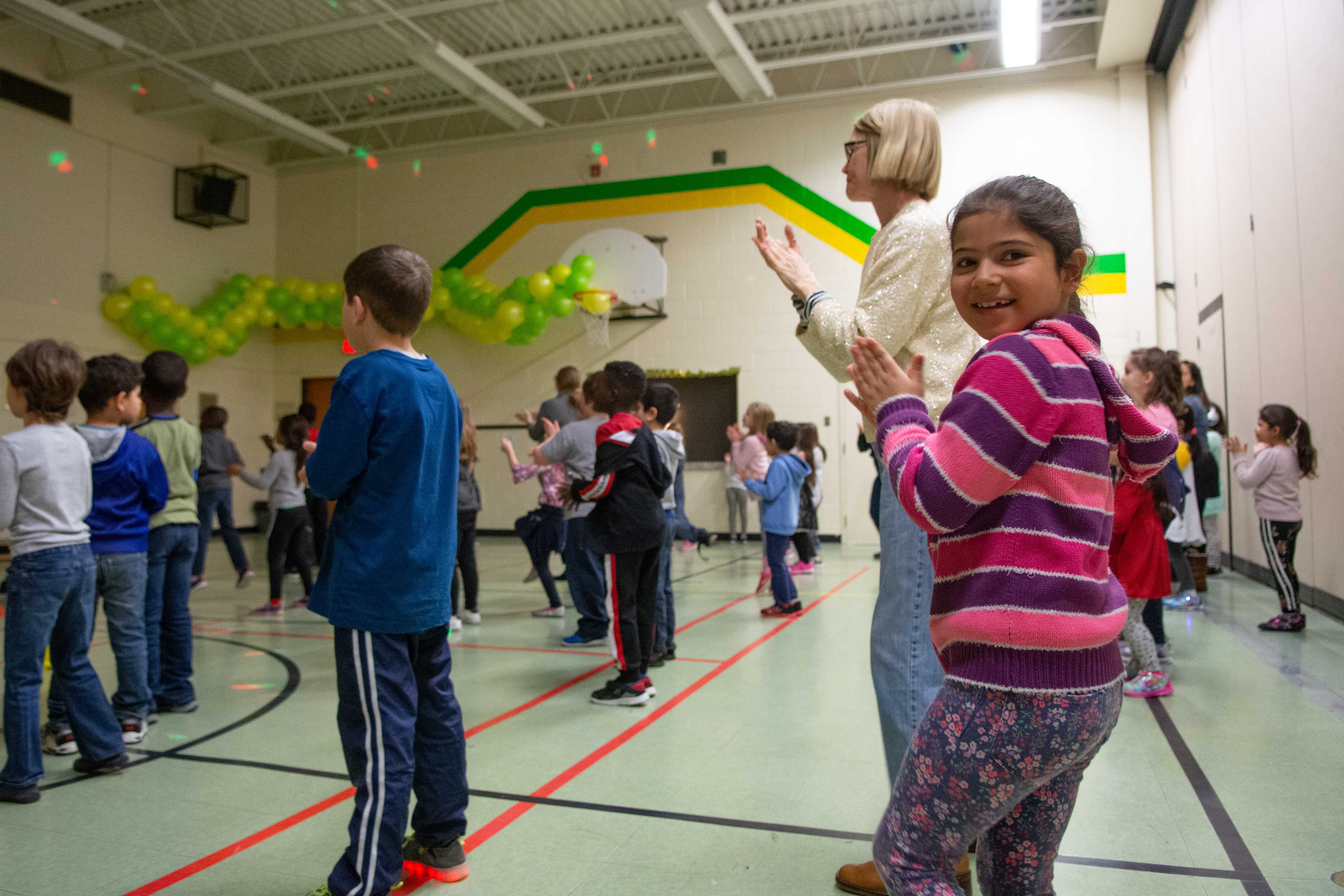 Student dances in the gym