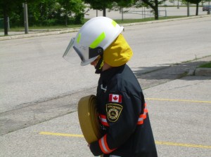 Jr. Fire Chief Noah, practicing his fire safety skills