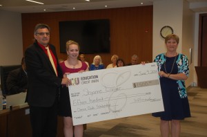 Shyanne Lagner receives the Dennis Daub Scholarship from Chair Ted Martin, and Melanie Mondoux - CEO of the Education Credit Union.