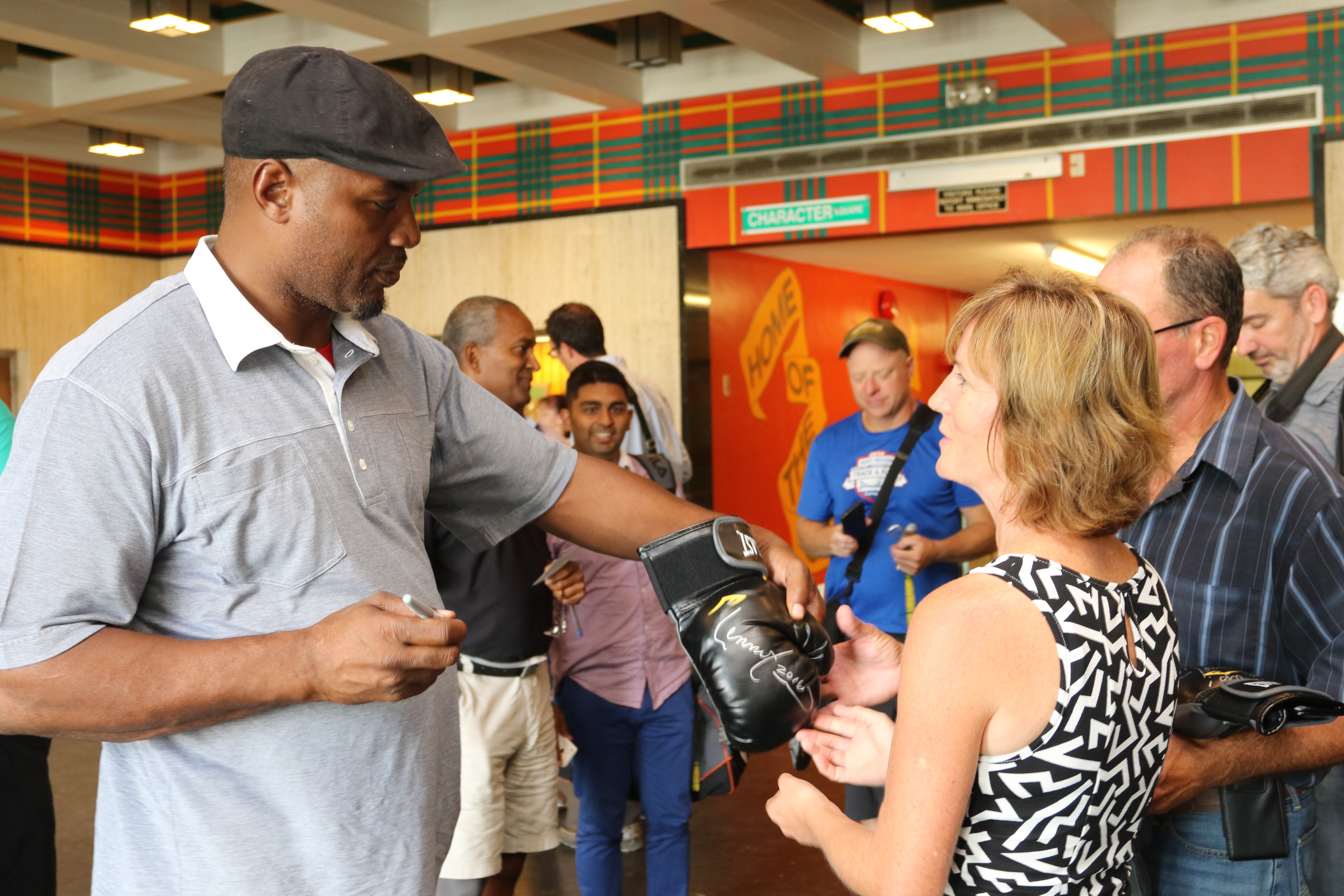 The legendary boxer signs autographs as he visits CHCI.