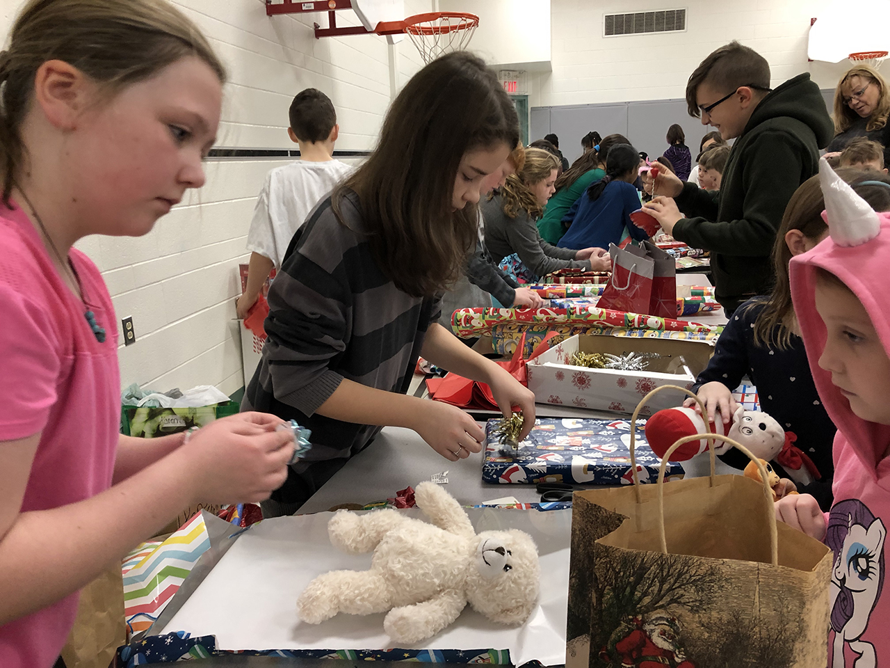 Students at Brigadoon Public School wrapping gifts purchased at their seasonal celebration.