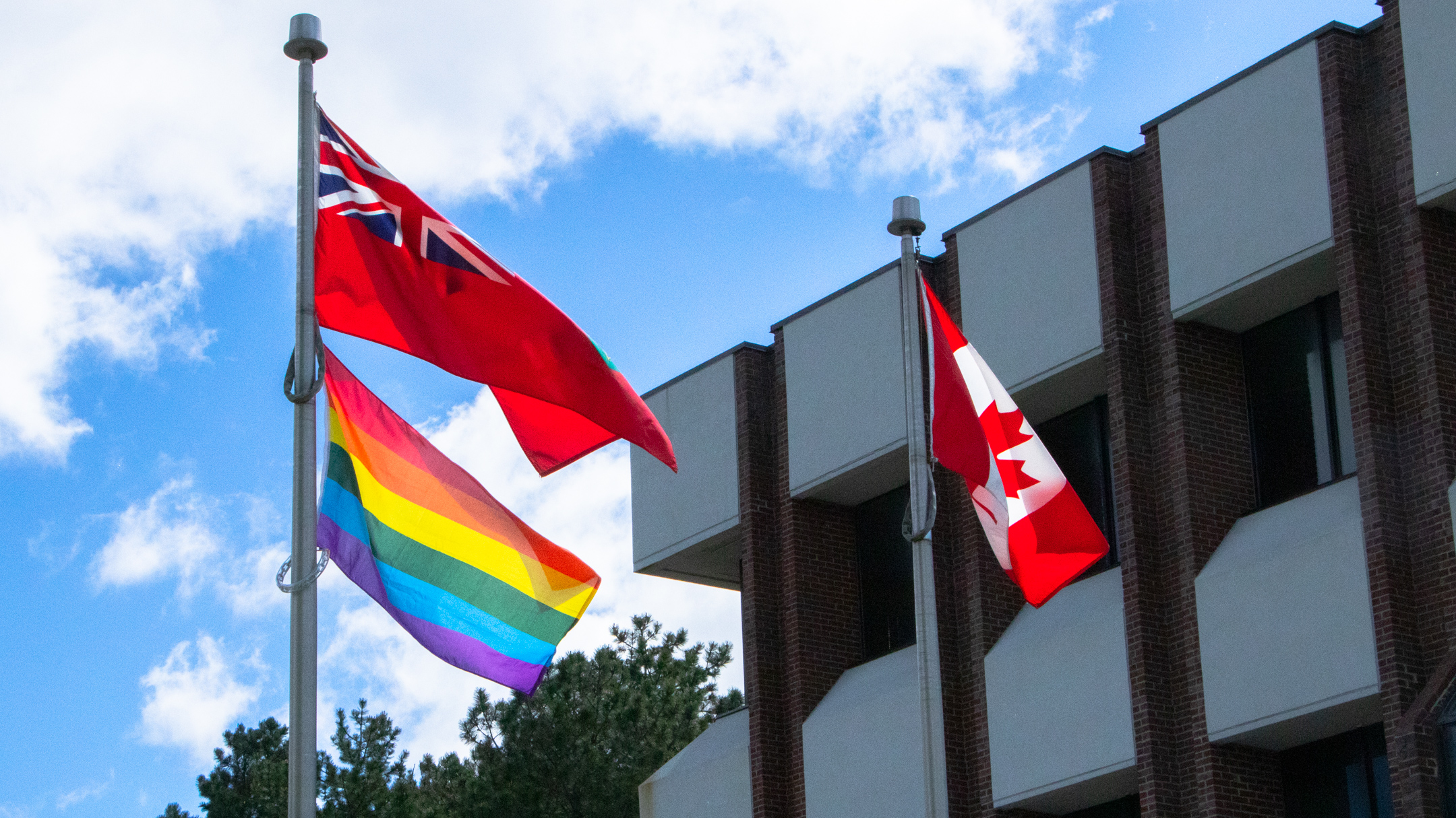 The Pride Flag flies beneath the Ontario flag at the Education Centre