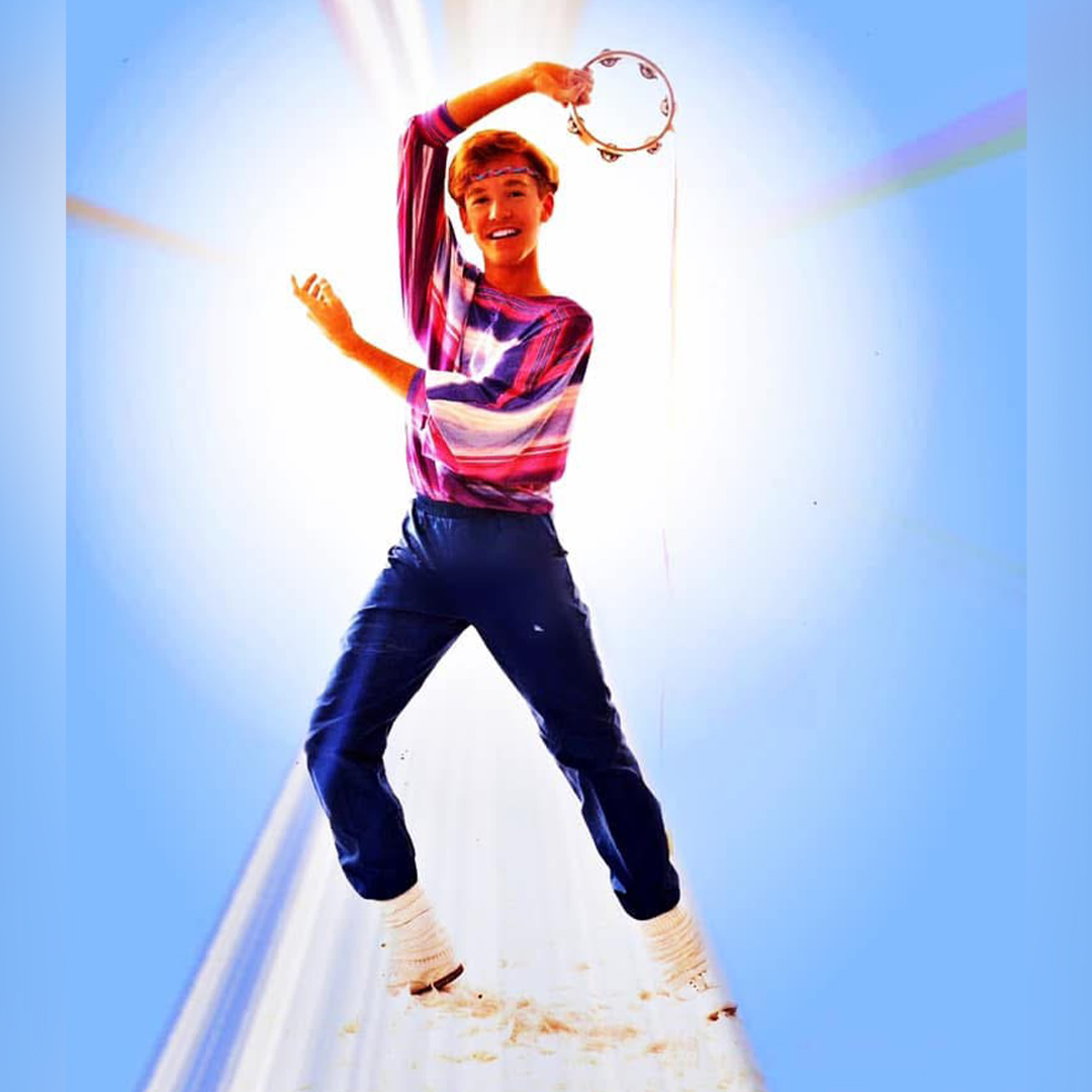 David Connolly young holding a tambourine