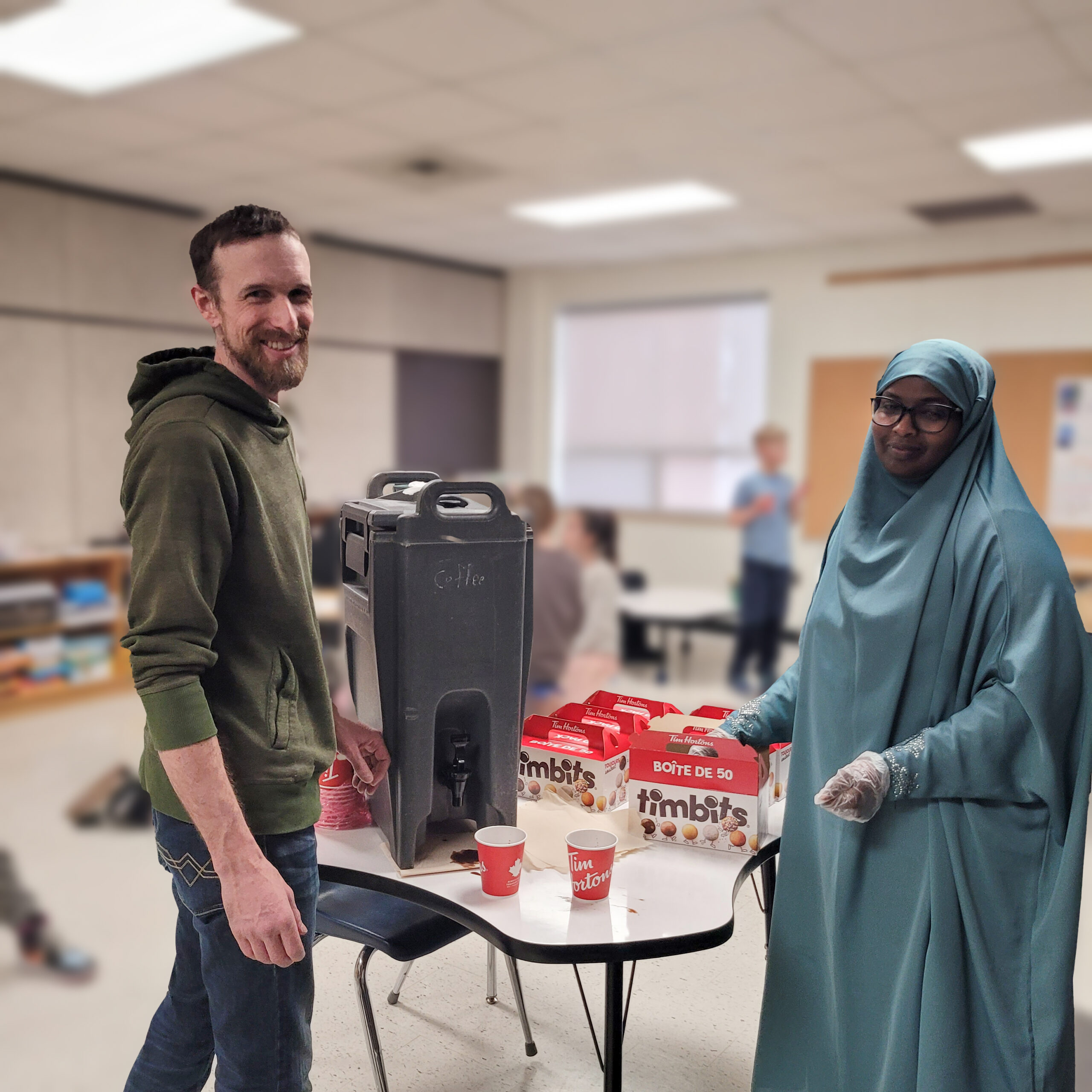 Members of the school council hand out doughnuts and hot chocolate 