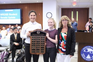 Student Trustees Mark Clubine and Hayley Birss are presented with a plaque from Trustee Carol Millar.