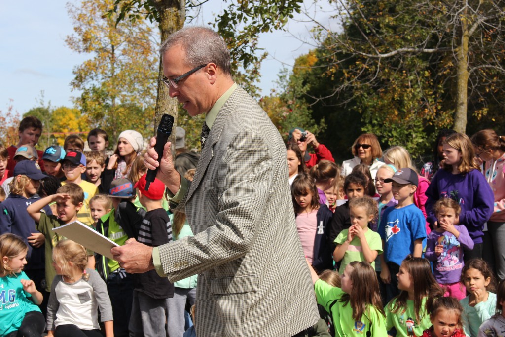Principal Mark Drummond gives remarks at the opening of the new outdoor area at the school.