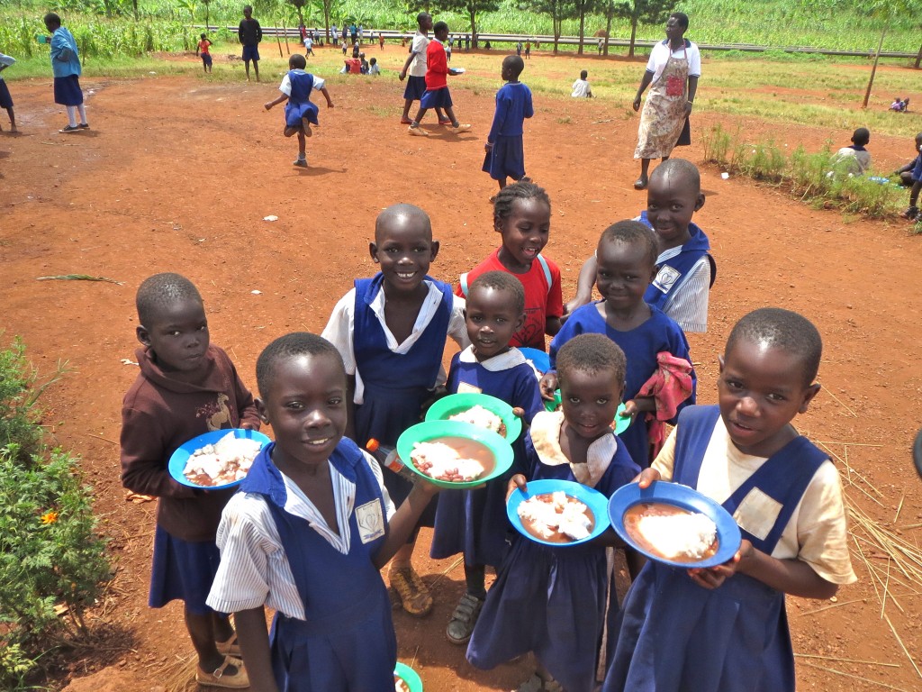 Children enjoying their posho & bean lunch.