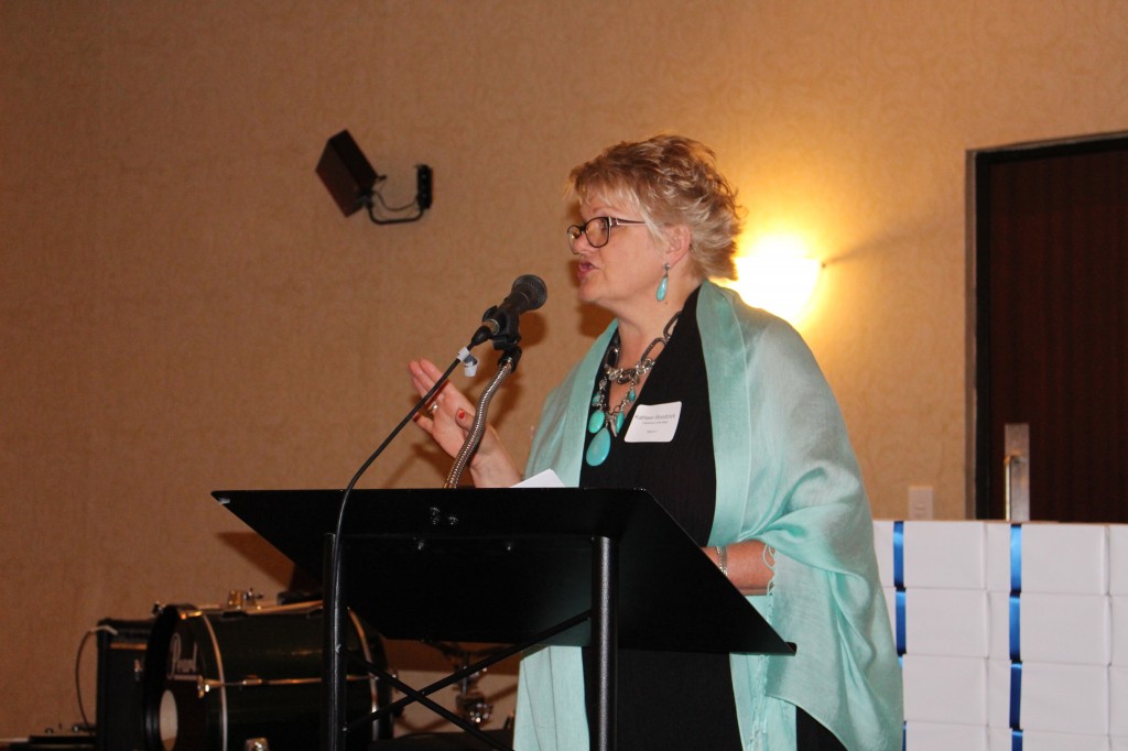 Kathleen Woodcock, Chairperson of the Board, giving the opening remarks.