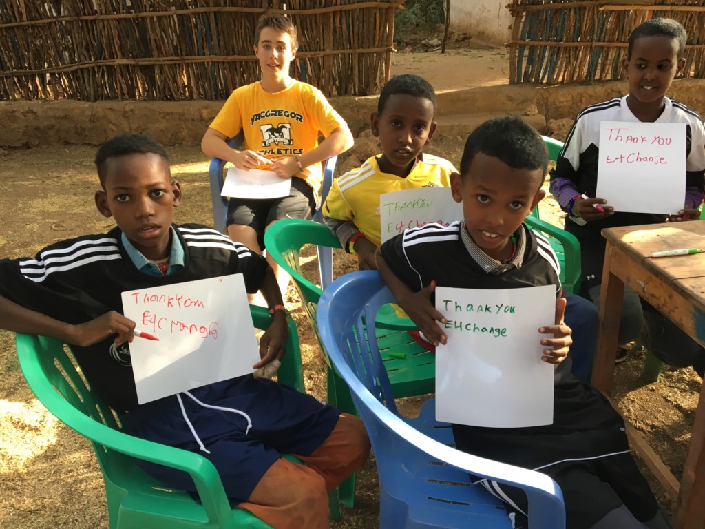 Students with thank you signs.