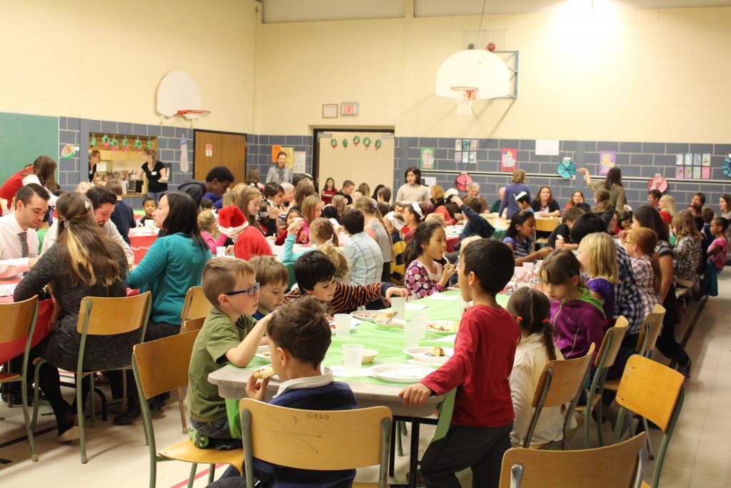 The whole school sitting down to enjoy the yummy turkey feast.