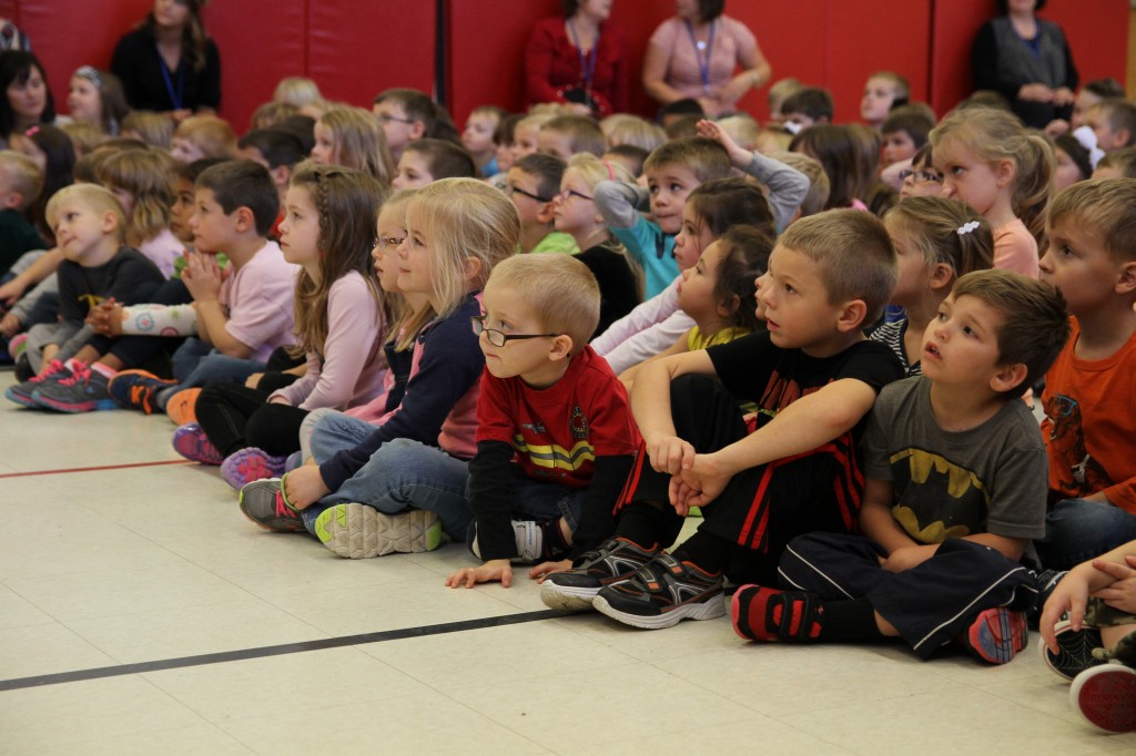 Students listening to the performance.