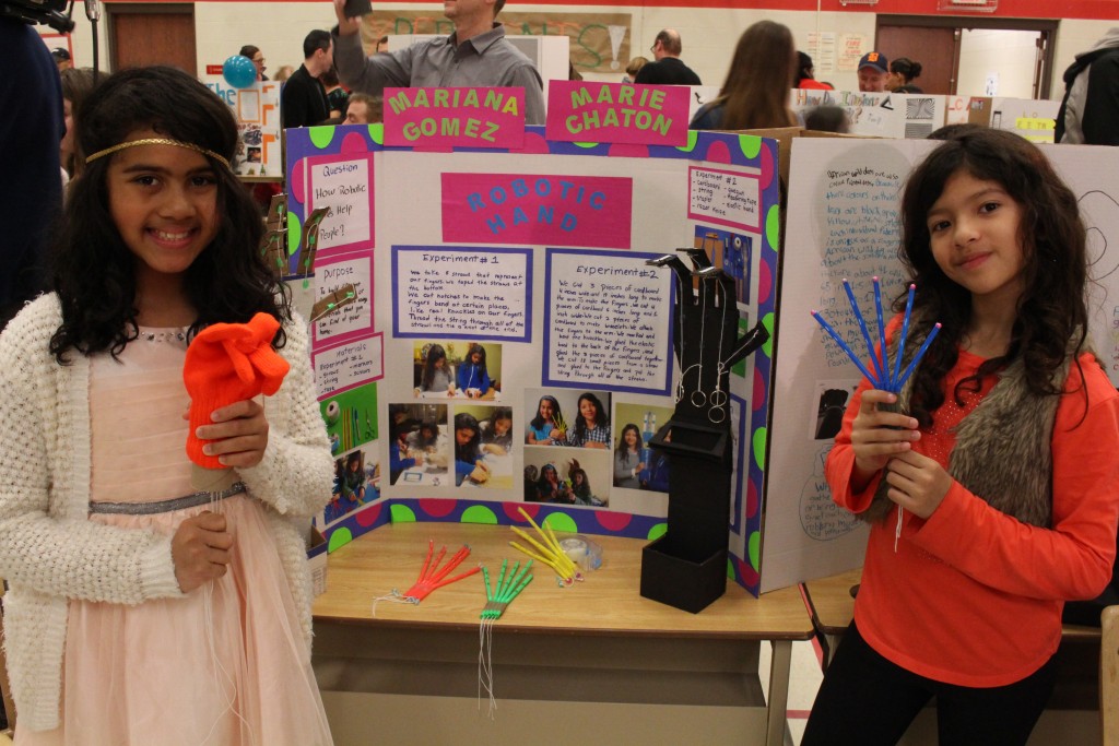 Two Crestview PS students show off their robotic hand display!