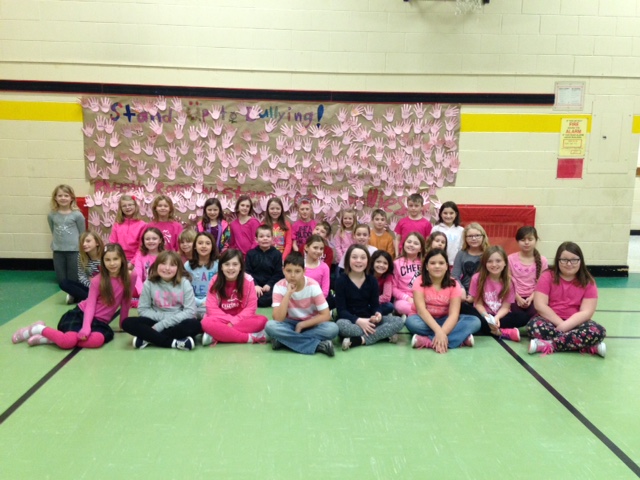 The Difference Maker Club posing with their Stand Up To Bullying poster.