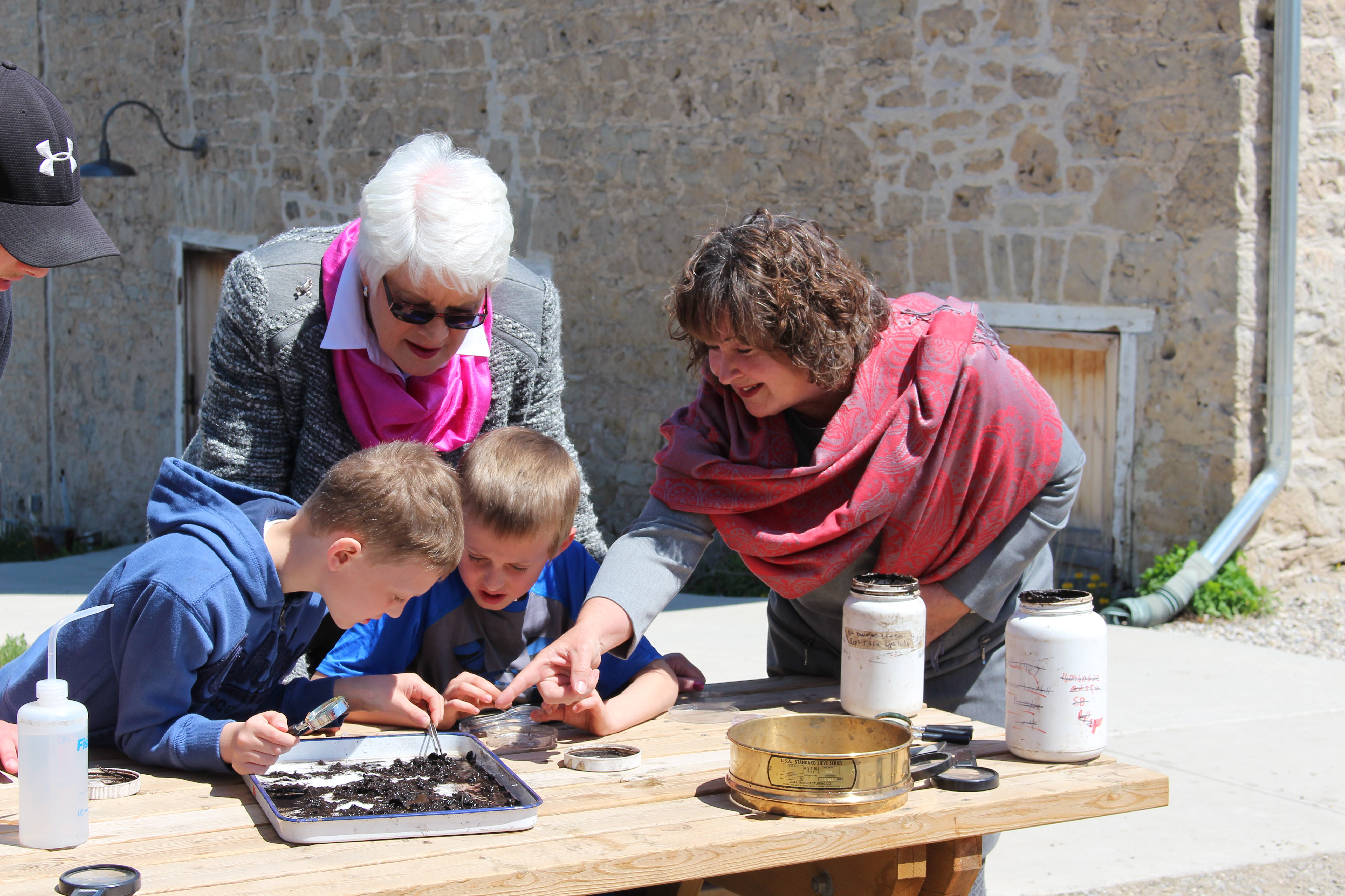 Minister Sandals and MPP McGarry taking a look at what students discovered!