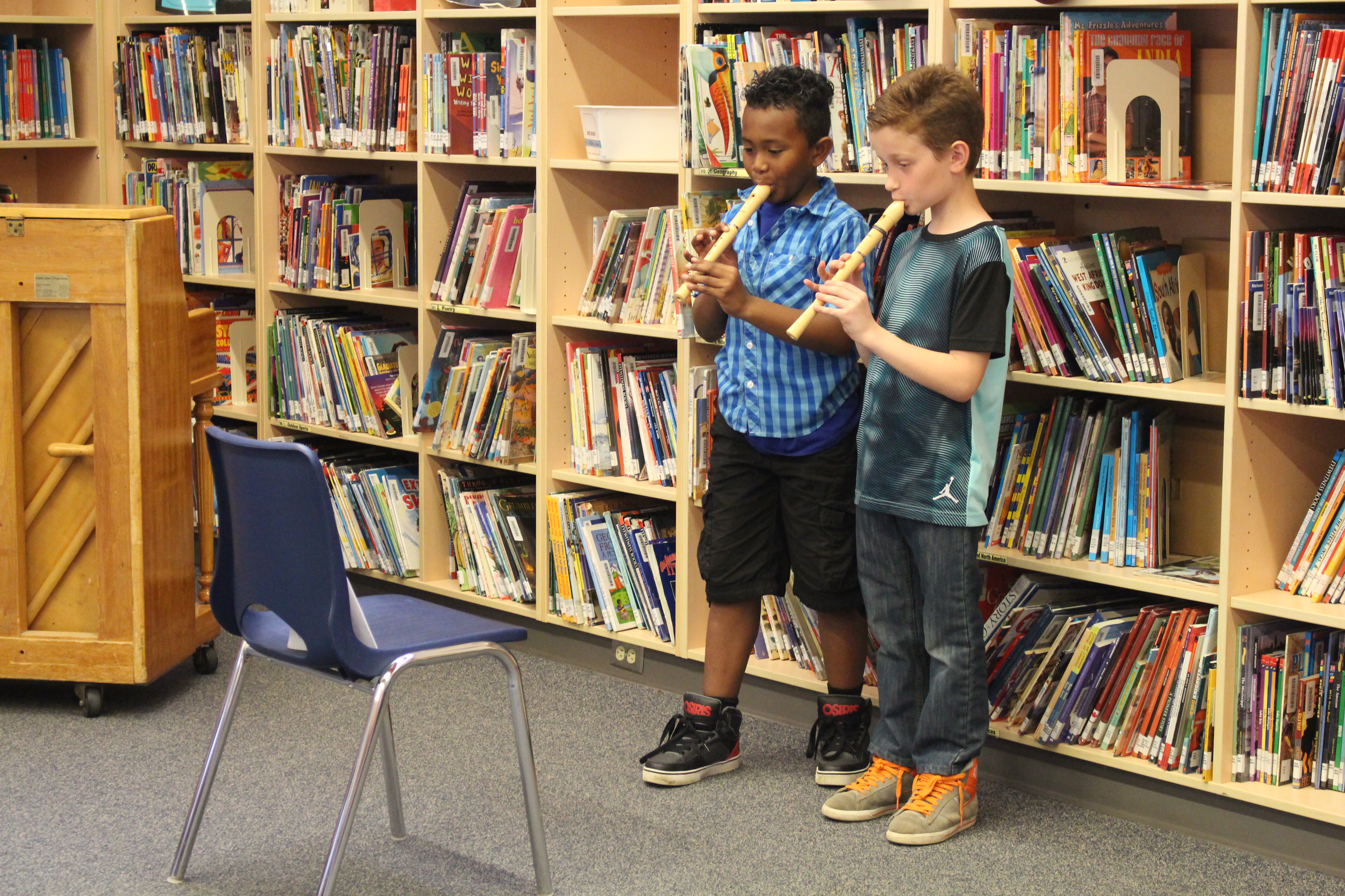 Two students performing the recorder.
