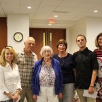 Cole receives his award from Linda Fabi, with his family and staff from Glenview Park SS