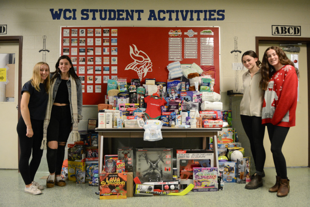 Students stand with donations