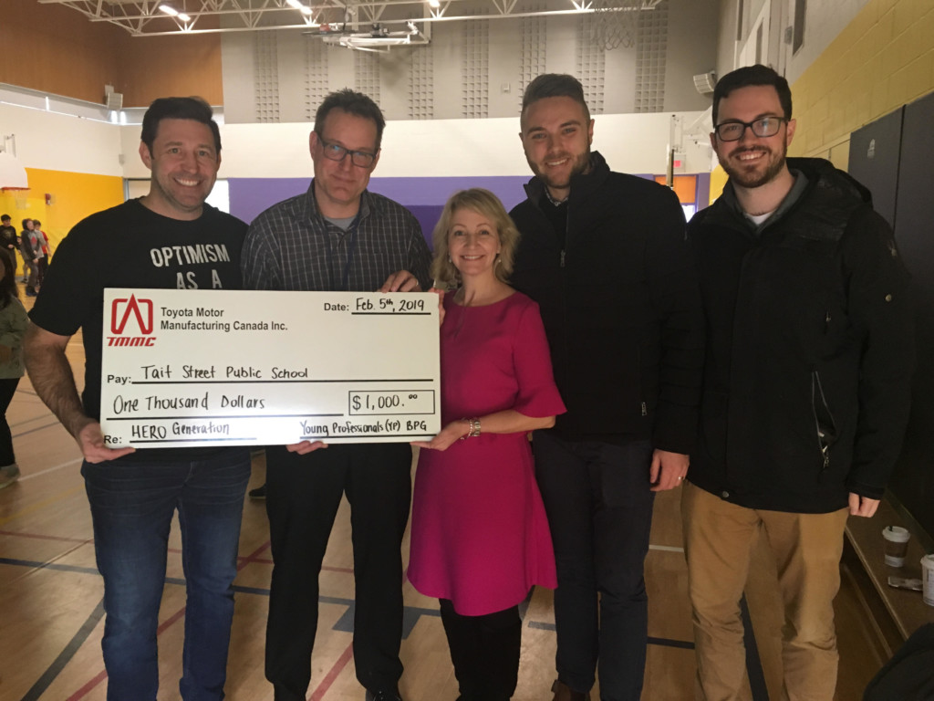 Toyota Employees Present a Cheque to Tait Street School Administrators.