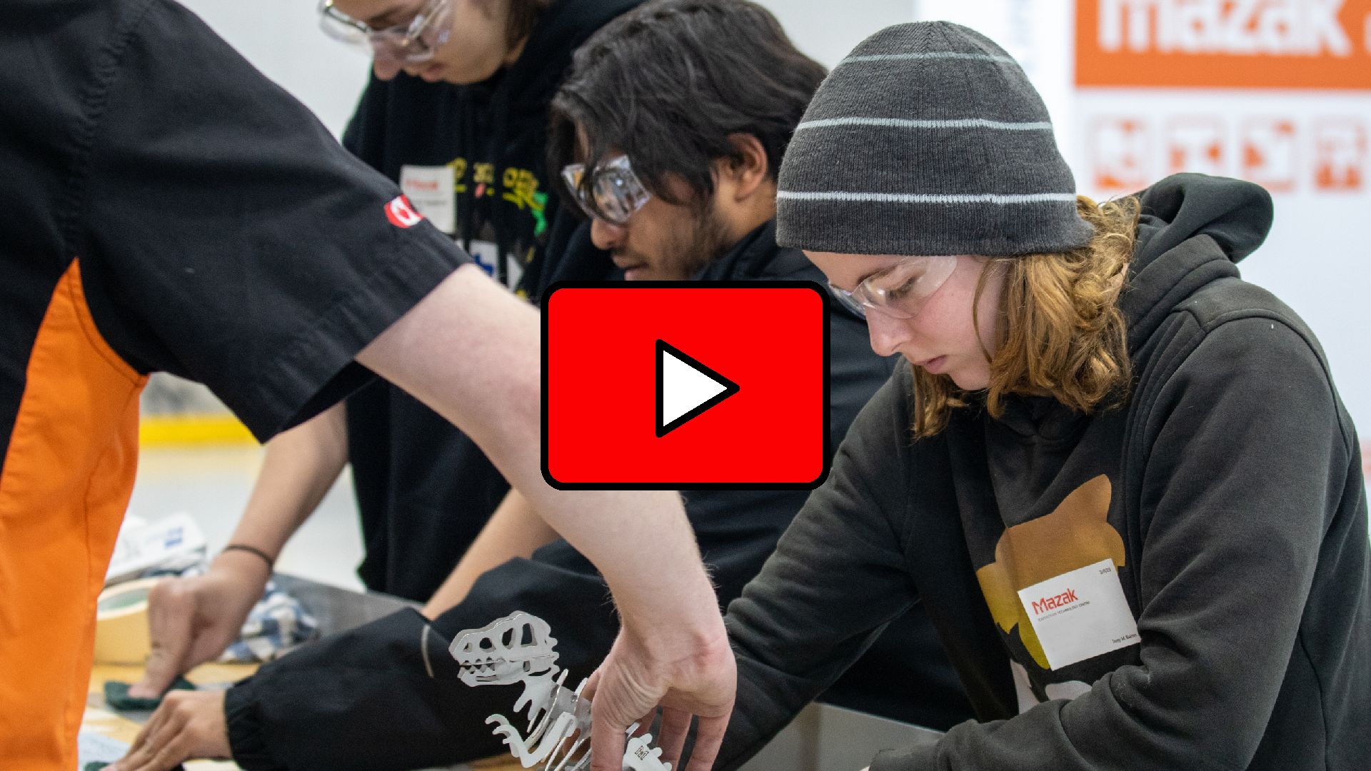 A hyperlinked photo leading to a YouTube video of students participating in Specialist High Skills Major learning