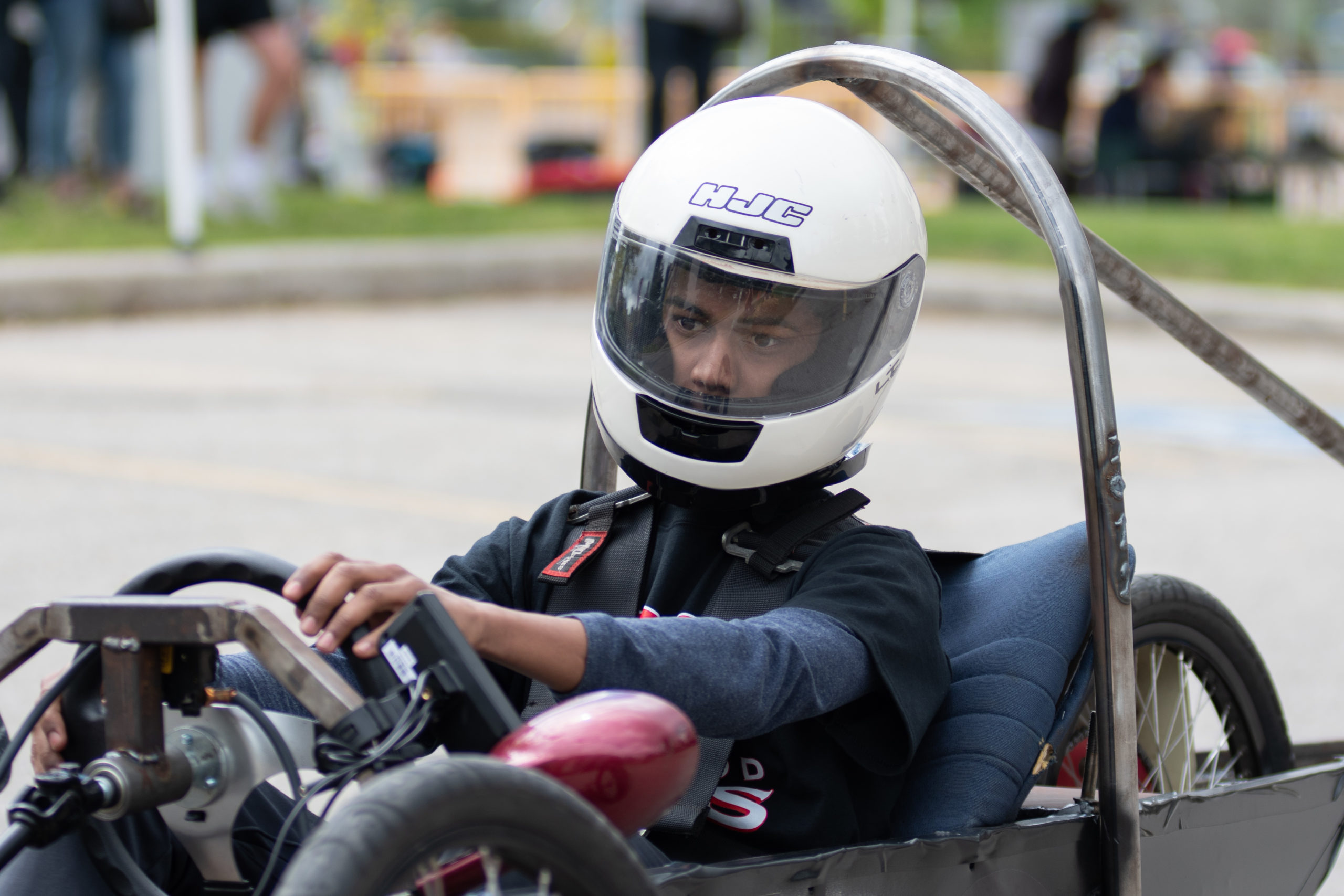 A student in the Eastwood Collegiate Institute car on the track leans in for a turn. 