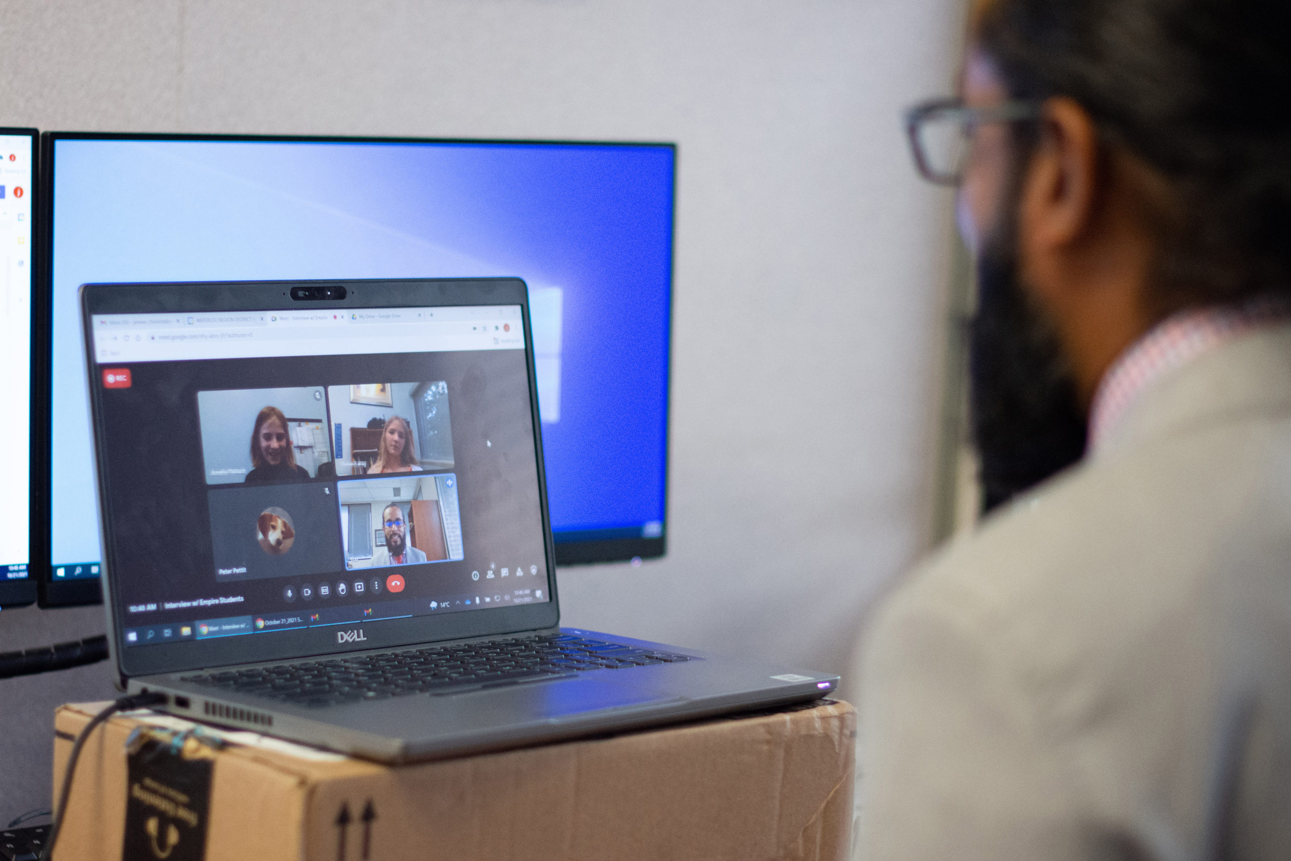 Director jeewan chanicka talks to students on a video call.