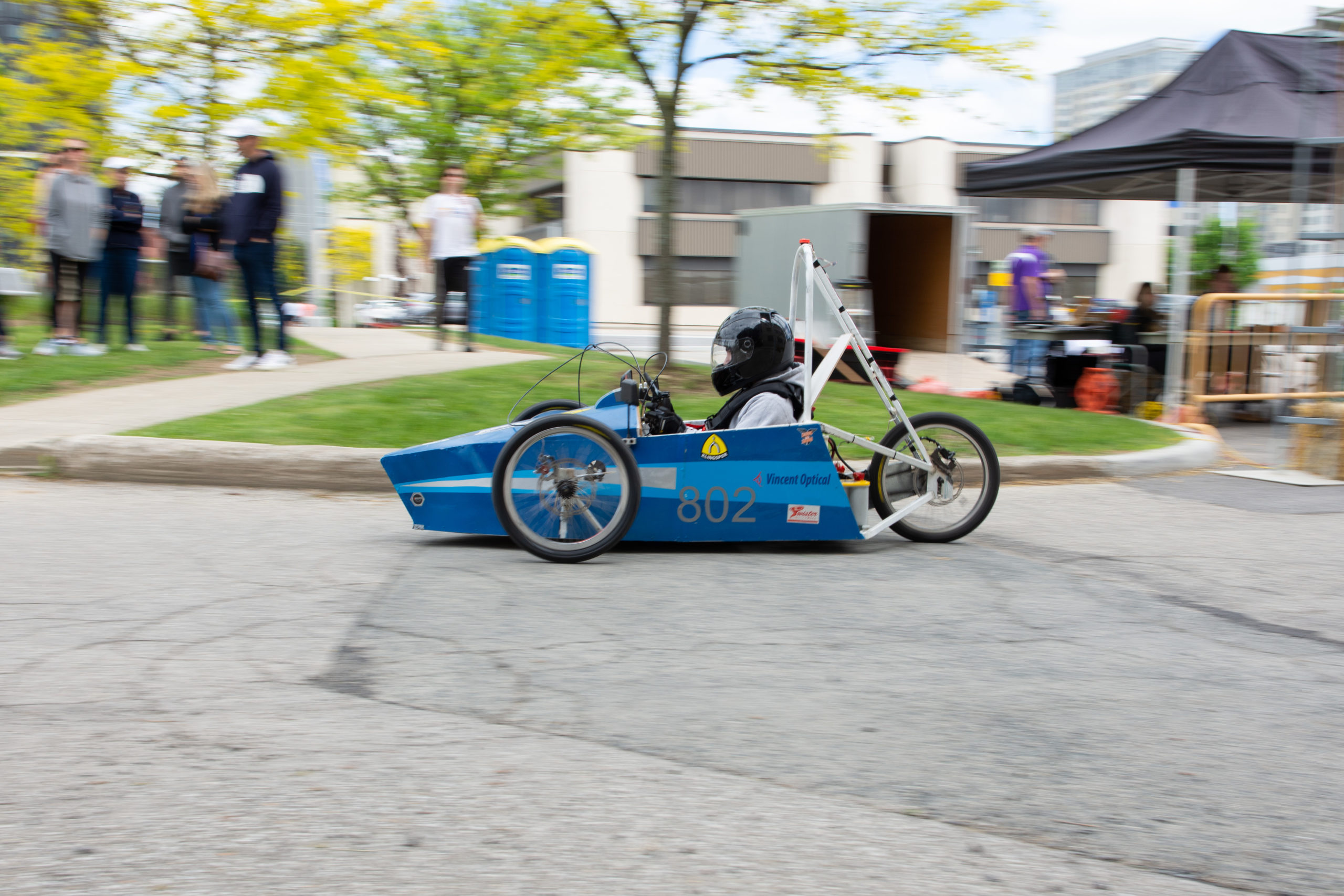 The Laurel Heights Secondary School car on the track, with the car in focus and background blurred.