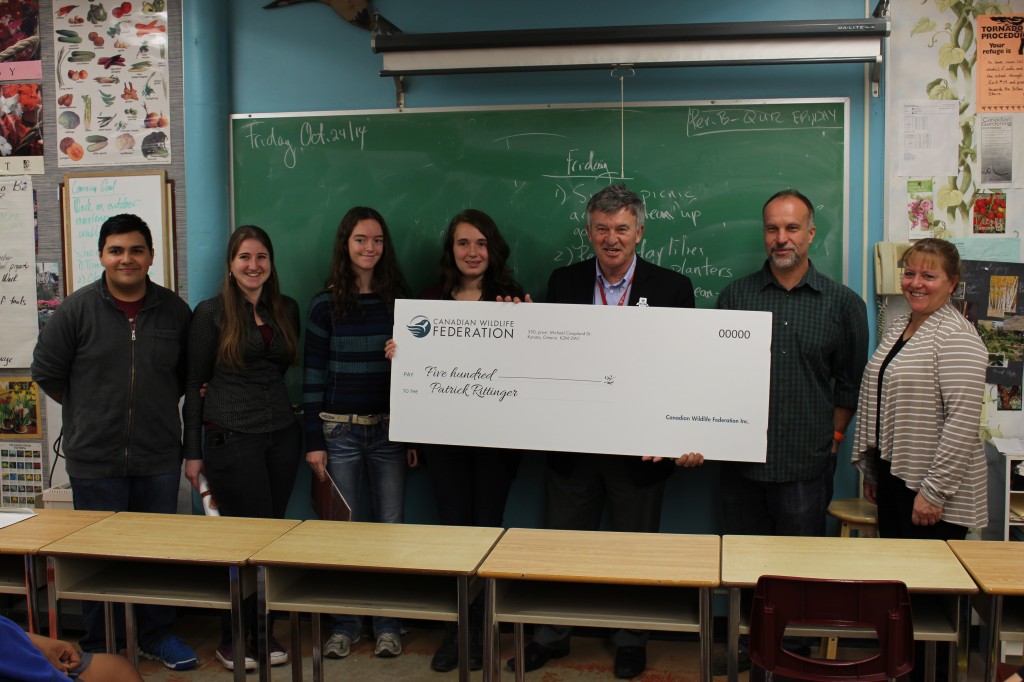 Ken Beattie presenting the cheque for $500 to KCI's horticulture class.