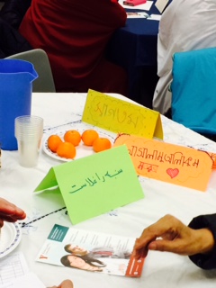A variety of languages & backgrounds fill the room.